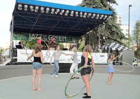 Concert-goers dance and play in front of stage. [Photo by Jesse Starita]