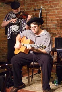 Guitarist Alexander Zappala solos as Dave Fowler comps on violin. [Photo by Tom Ineck]