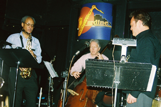 Gerald Spaits solos as Perkins and Kessler listen. [Photo by Tom Ineck]