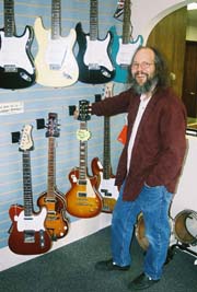 Popek's retail showroom includes a selection of electric guitars. [Photo by Tom Ineck]