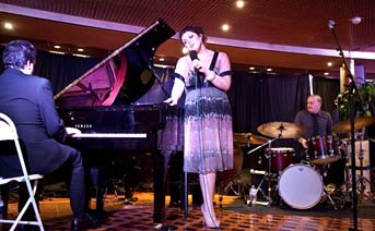 Singer Jane Monheit with her pianist and drummer [Photo by Fran Kaufman]