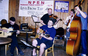 Neon Violin Quartet plus guitarist Greg Gunter [Photo by Tom Ineck]