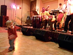 Two-year-old Ella Jane Lounsbury swings to the sounds of Ashanti [Photo by Tom Ineck]