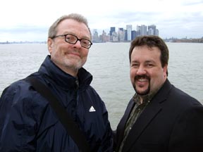 Russ Dantzler and Tony Rager on the Staten Island Ferry with the skyline of Manhattan in background [Photo by Tom Ineck]