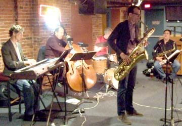 Frank Basile on baritone sax solos with KC rhythm section and Rob Scheps (right). [Photo by Tom Ineck]