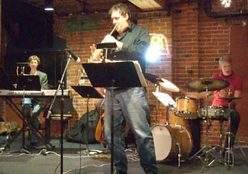Rob Scheps solos on soprano sax at Brewsky's Jazz Underground. [Photo by Tom Ineck]