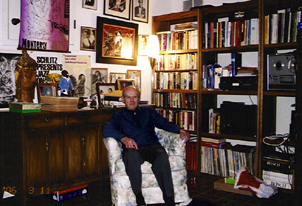 Jean Reldy sits in his office in Colorado Springs surrounded by jazz memorabilia. [Photo by Dan Demuth]