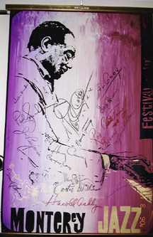 Reldy's poster of the Monterey Jazz Festival, bearing autographs of Duke Ellington, Al Grey, George Duvivier, Clark Terry, Ray Brown, Harry Carney, Cootie Williams, Harold Ashby, Rufus Jones, Paul Gonsalves, Joe Benjamin, Willie Cook, Russell Procope, Harold Johnson and Norris Turner. [Photo by Dan Demuth]