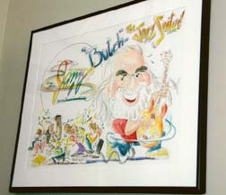 Framed drawing of Butch Berman as "Jazz Santa" oversees the main room. [Photo by Richard S. Hay]