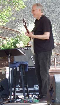 Bill Frisell with handcuffs [Photo by Tom Ineck]