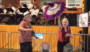 My cousin Jerry Siefken (left) is among the second-liners in the Economy Hall tent. [Photo by Tom Ineck]