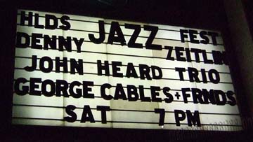 The Raven Theater marquee advertises a formidable triple bill. [Photo by Tom Ineck]