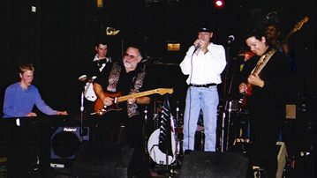 Guitarist Duke Robillard with Travis & the Flame Cats at the Zoo Bar in 2002 [Photo by Rich Hoover]