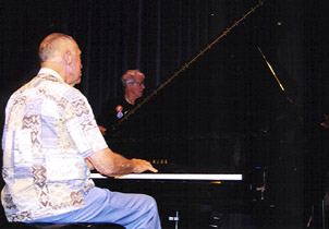 Pianist Paul Smith hovers over the keyboard. [Photo by Tom Ineck]