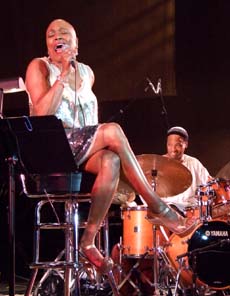 Dee Dee Bridgewater wails as drummer Winard Harper adds emphasis. [Photo by Tom Ineck]