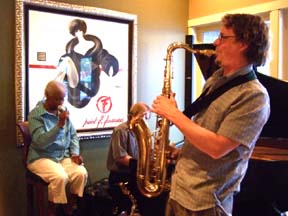 Andrew Vogt accompanies a local singer on tenor sax [Photo by Tom Ineck]